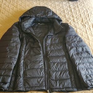 Black puffer jacket with hood.